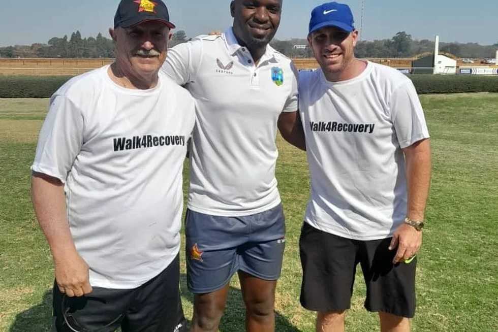 Brendan Taylor, Dave Houghton and a Zimbabwe rugby representative during a 50km walk that was organised to raise funds for a new recovery centre